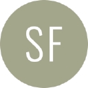 She's Fluent logo